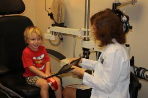 Dr. Herlevich performing eye exam services